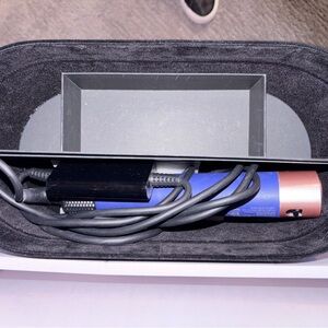 Dyson Navy air wrap dryer.